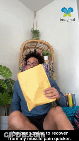 Man Sitting In Chair Holding Yellow Envelope Saying Ive Been Trying GIF