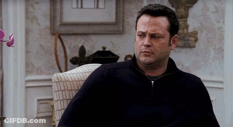 Man Sitting In Chair Looking At Camera GIF
