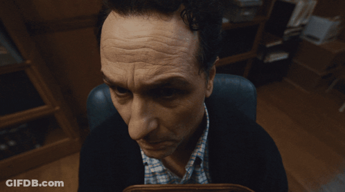 Man Sitting In Chair Looking GIF