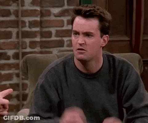 Man Sitting In Chair Making Funny Face GIF