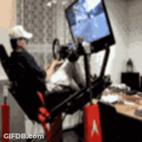 Man Sitting In Chair Playing Video Game GIF