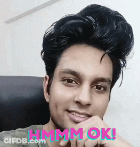 Man Sitting In Chair Saying Hmm Ok GIF