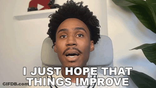 Man Sitting In Chair Saying I Just Hope That Things Improve GIF