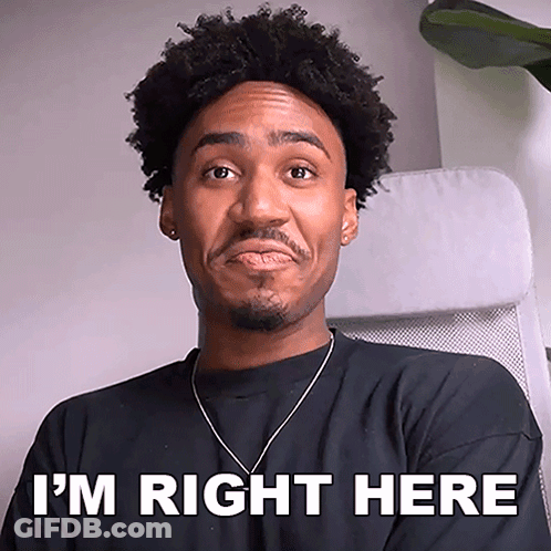 Man Sitting In Chair Saying I'm Right Here GIF