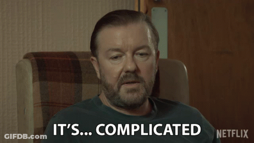 Man Sitting In Chair Saying It's Complicated GIF