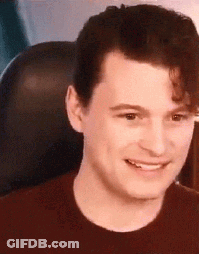 Man Sitting In Chair Smiling GIF