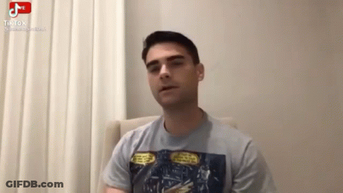 Man Sitting In Chair Talking On Video Call GIF
