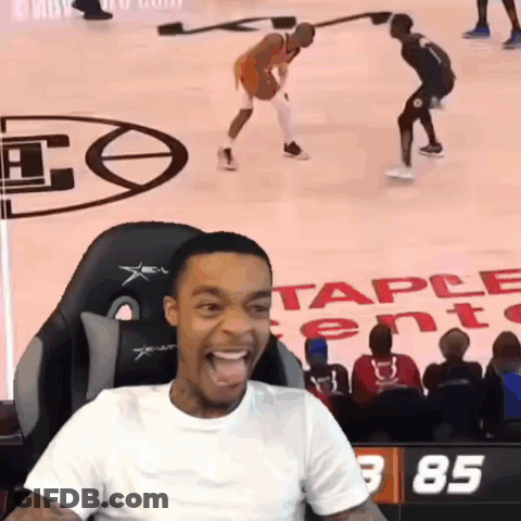 Man Sitting In Chair Watching Basketball Game With Number 85 GIF