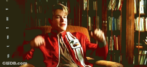 Man Sitting In Chair With Arms Up GIF