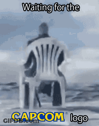 Man Sitting In Chair With Capcom Logo GIF