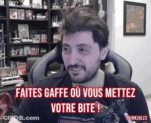 Man Sitting In Chair With Faites Gaffe O Vous Mettez Votre Bite GIF