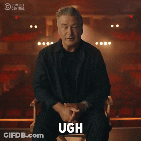 Man Sitting In Chair With Hand On Face Comedy Central Logo GIF