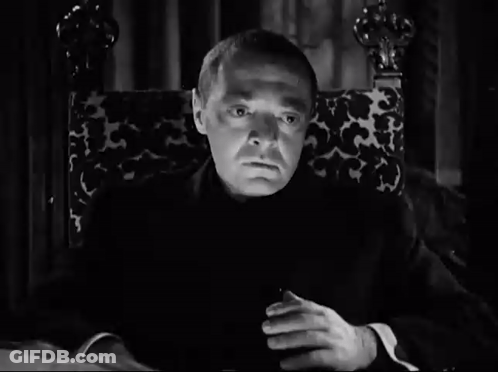 Man Sitting In Chair With Hands Folded GIF