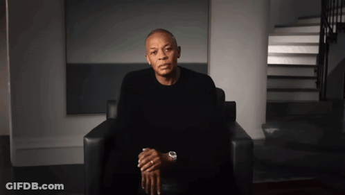 Man Sitting In Chair With Hands Folded GIF