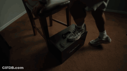 Man Sitting In Chair With Legs Crossed GIF