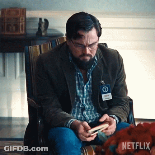 Man Sitting In Chair With Netflix Name Tag GIF