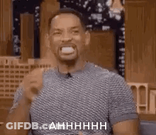 Man Sitting In Chair With Open Mouth And Tongue Out GIF