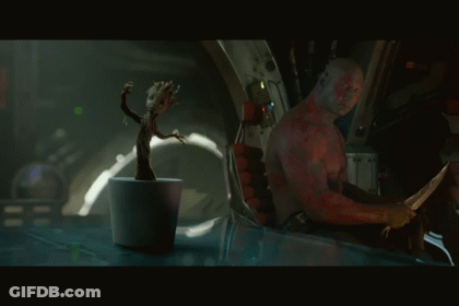 Man Sitting In Chair With Plant GIF