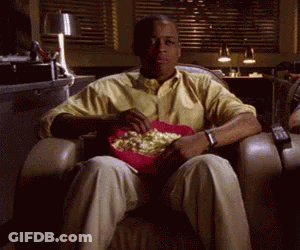 Man Sitting In Chair With Popcorn GIF