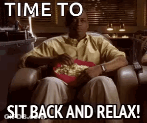 Man Sitting In Chair With Popcorn GIF