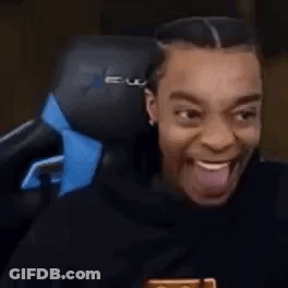 Man Sitting In Chair With Tongue Out GIF