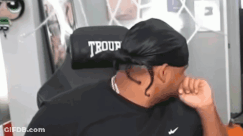 Man Sitting In Chair With Word Troup GIF