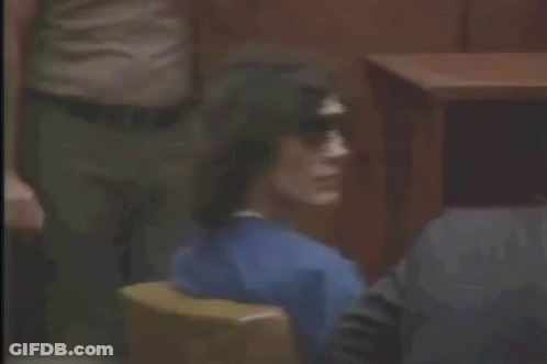 Man Sitting In Courtroom Wearing Sunglasses GIF