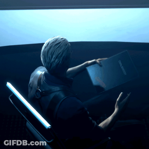Man Sitting In Dark Room Holding Book Saying Cool Space GIF