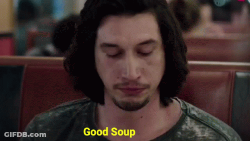 Man Sitting In Diner Eyes Closed Saying Good Soup GIF