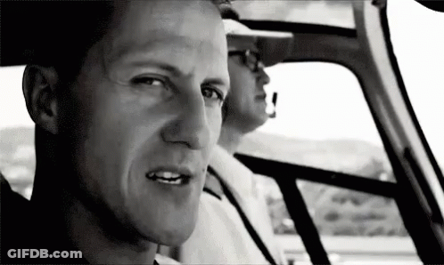 Man Sitting In Driver's Seat Looking Out Window GIF
