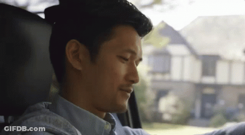 Man Sitting In Driver's Seat Looking Out Window GIF