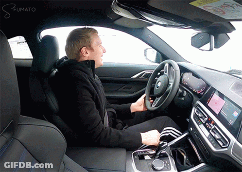 Man Sitting In Drivers Seat With Fumato GIF