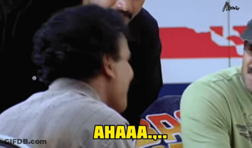Man Sitting In Front Of Ahaa Sign GIF