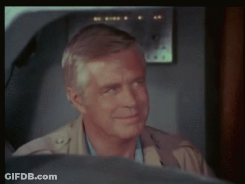 Man Sitting In Front Of Airplane With Letter G GIF