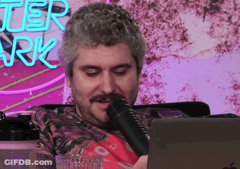 Man Sitting In Front Of Better Ark Sign GIF