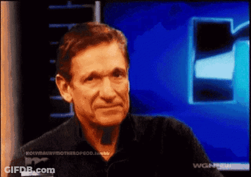 Man Sitting In Front Of Blue Screen With WGN GIF
