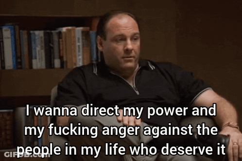 Man Sitting In Front Of Bookshelf With Anger Quote GIF
