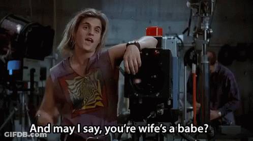 Man Sitting In Front Of Camera Saying Wife's A Babe GIF