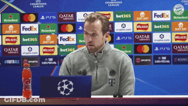 Man Sitting In Front Of Champions League Ad GIF