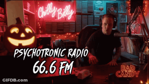 Man Sitting In Front Of Chilly Billy Psychotronic Radio 66.6 FM Neon Sign GIF