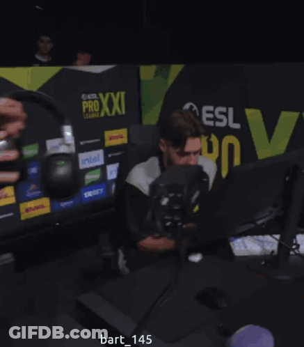 Man Sitting In Front Of Computer With Pro Xxi League Sign GIF