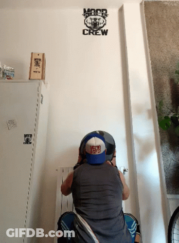 Man Sitting In Front Of Crew Wall GIF
