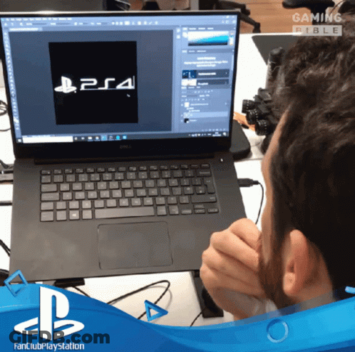 Man Sitting In Front Of Dell Laptop With PS4 Logo GIF