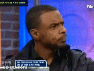 Man Sitting In Front Of DNA Test Sign GIF