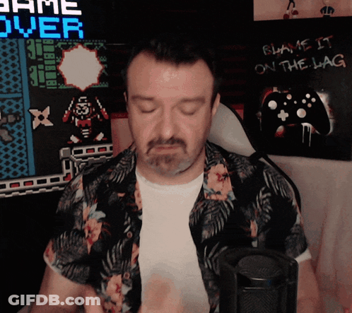 Man Sitting In Front Of Game Over Sign GIF
