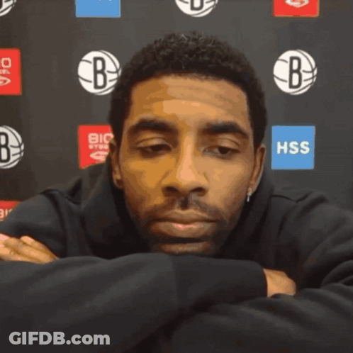 Man Sitting In Front Of HSS Sign GIF