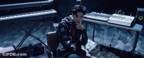 Man Sitting In Front Of Keyboard And Mixer GIF