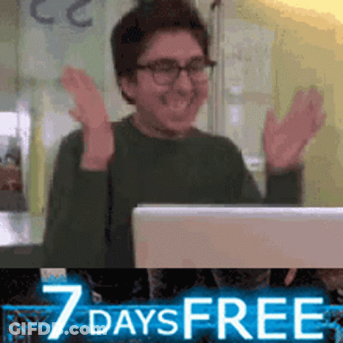 Man Sitting In Front Of Laptop With Hands In Air GIF