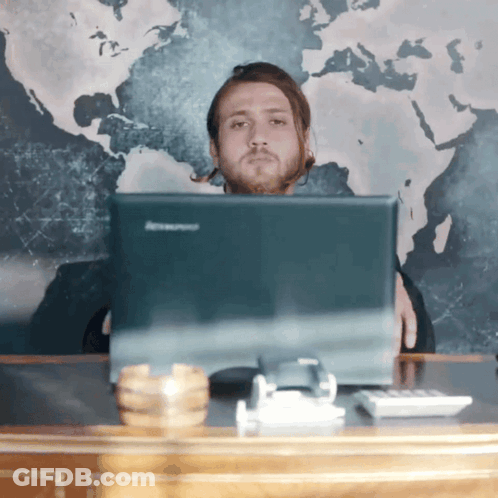 Man Sitting In Front Of Lenovo Computer Monitor GIF