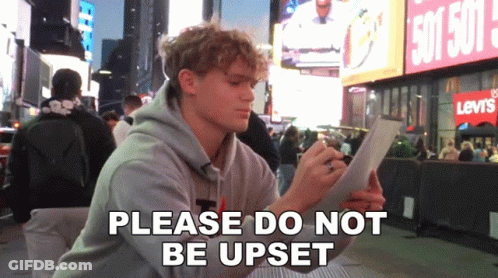 Man Sitting In Front Of Levi's Store GIF